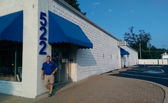 Eric Grassman, owner of Valley Laundry Inc., standing in front of the business at 522 South Main Street in Franklin, Ohio